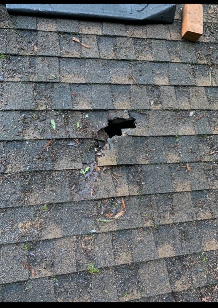 A puncture in composite shingle roof causing a leak that must be repaired by a roofing company in Aptos CA.