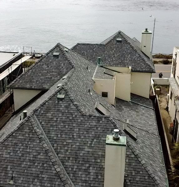 Multi pitch asphalt shingle roof installed near the coast by local roofing company in Santa Cruz CA